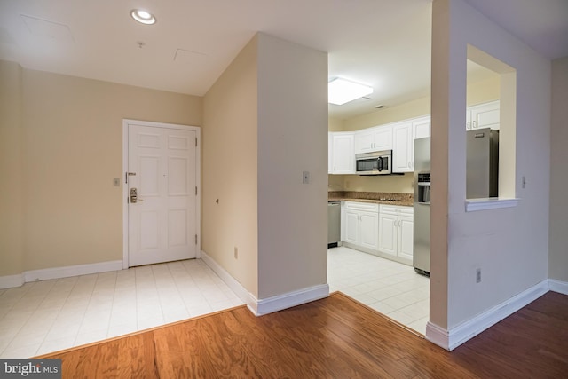 entryway with light wood-type flooring