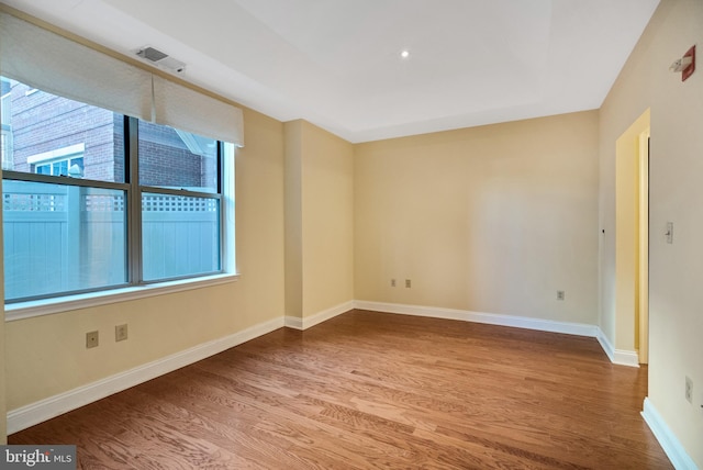 unfurnished room featuring wood-type flooring