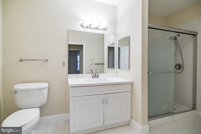 bathroom with vanity, toilet, walk in shower, and tile patterned flooring