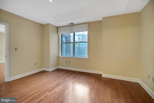 empty room featuring hardwood / wood-style flooring