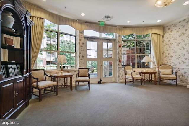 sitting room with french doors, carpet, and plenty of natural light