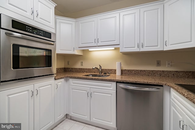 kitchen featuring white cabinetry, stainless steel appliances, and sink