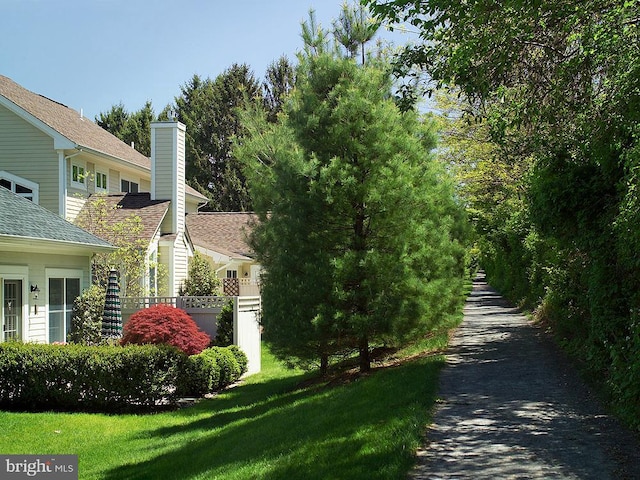 view of side of home featuring a lawn