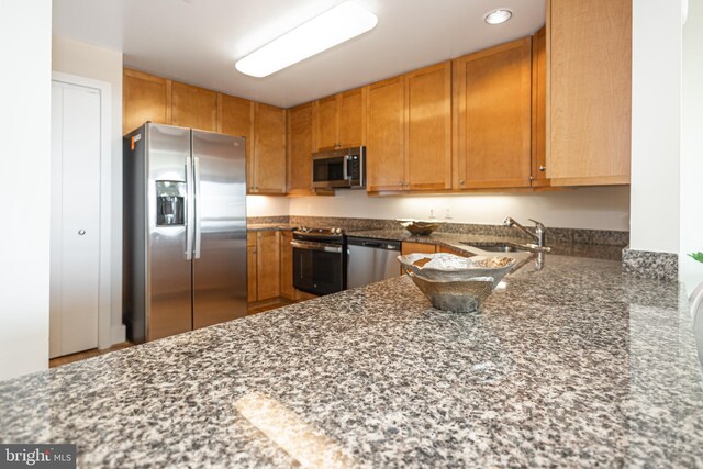 kitchen with sink and appliances with stainless steel finishes