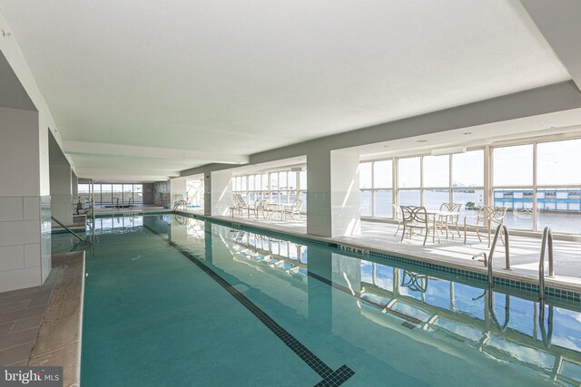 view of pool with a water view