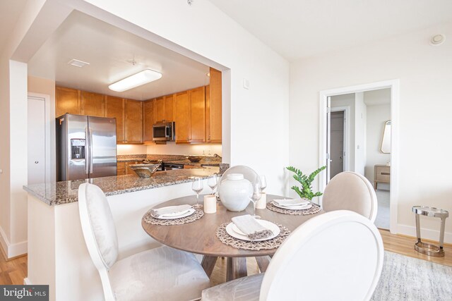 dining area featuring light hardwood / wood-style floors