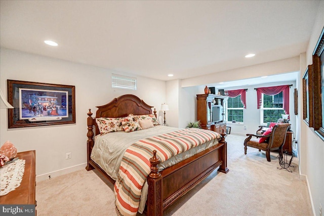 bedroom featuring light colored carpet