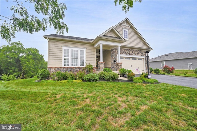 craftsman-style house with a front yard