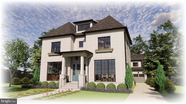 view of front of house featuring a front yard and a garage