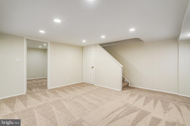 basement featuring light carpet