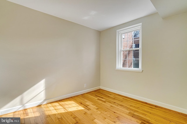 spare room featuring light wood-type flooring