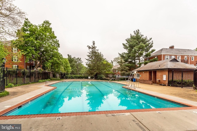 view of swimming pool with a patio