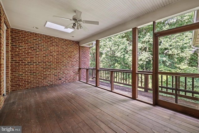 exterior space featuring a skylight and ceiling fan