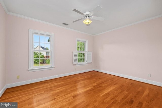 empty room with light hardwood / wood-style floors, crown molding, and ceiling fan