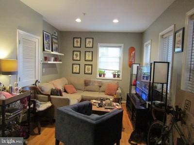 living room featuring recessed lighting and light wood-style flooring