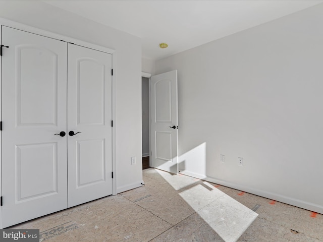 unfurnished bedroom with a closet