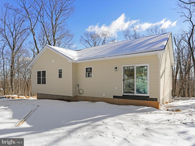 view of snow covered house