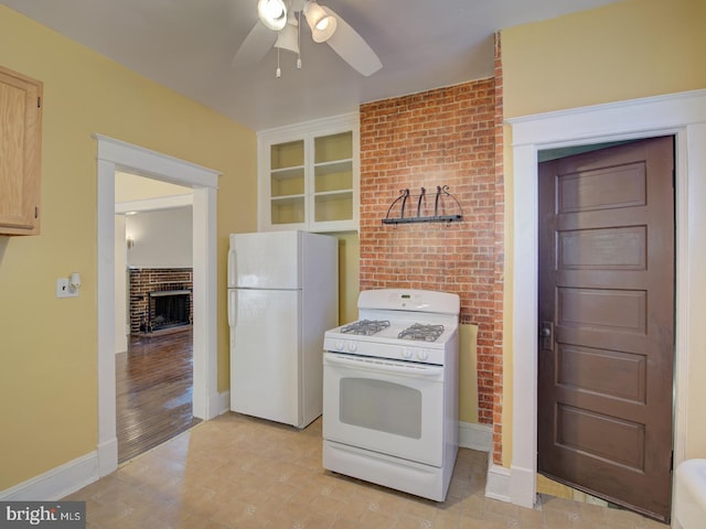 kitchen featuring light hardwood / wood-style floors, light brown cabinets, ceiling fan, white appliances, and built in features