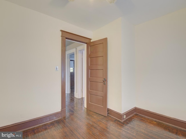 unfurnished room featuring dark hardwood / wood-style floors