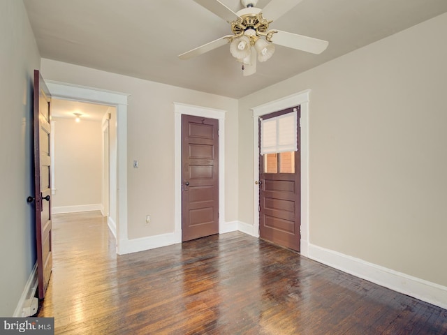 unfurnished bedroom with dark wood-type flooring, ceiling fan, and a closet