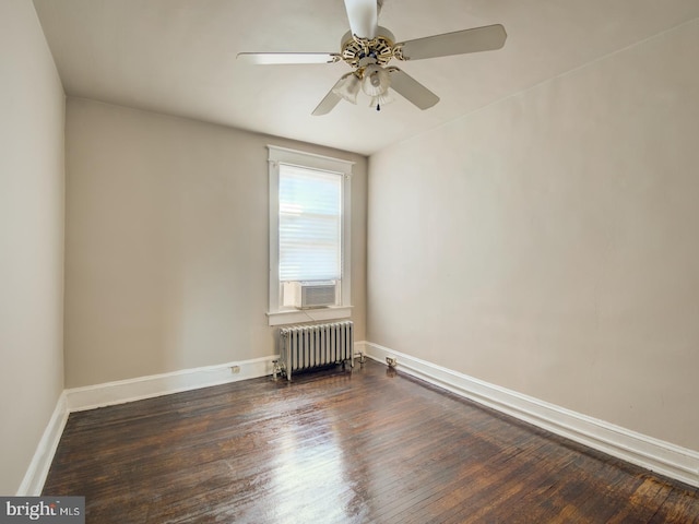 unfurnished room featuring radiator heating unit, cooling unit, ceiling fan, and dark hardwood / wood-style flooring