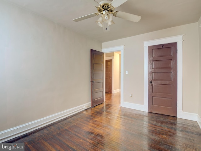 unfurnished bedroom featuring ceiling fan, a closet, and dark hardwood / wood-style flooring