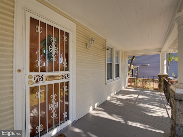 doorway to property featuring covered porch