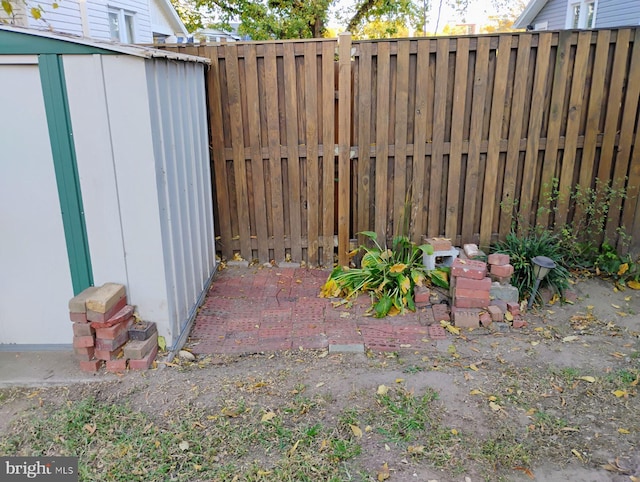 view of patio / terrace featuring a storage unit