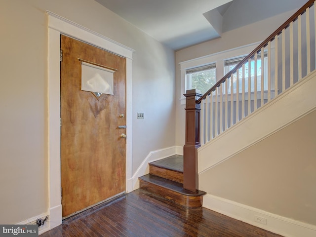 foyer entrance with dark hardwood / wood-style flooring