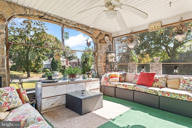 sunroom / solarium with ceiling fan