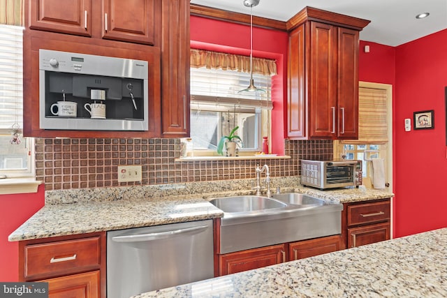 kitchen featuring decorative backsplash, decorative light fixtures, stainless steel appliances, and plenty of natural light