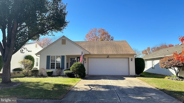 single story home featuring a front yard and a garage