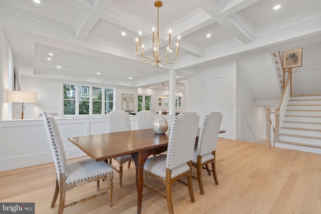 dining area with beam ceiling, coffered ceiling, and light hardwood / wood-style floors