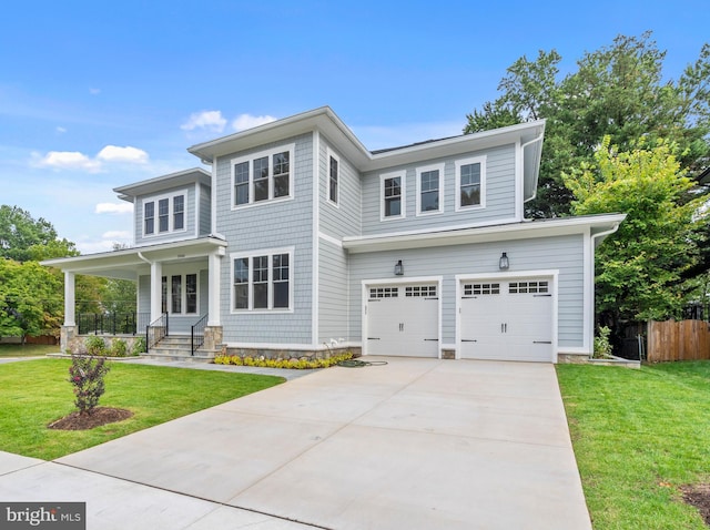 view of front facade with covered porch, a front lawn, and a garage