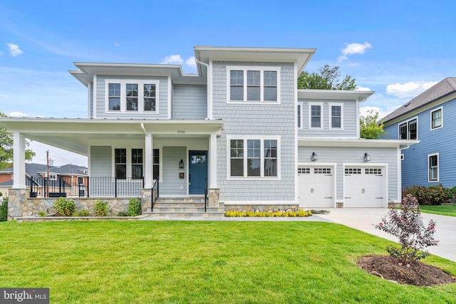 view of front of home featuring a porch, a front lawn, and a garage