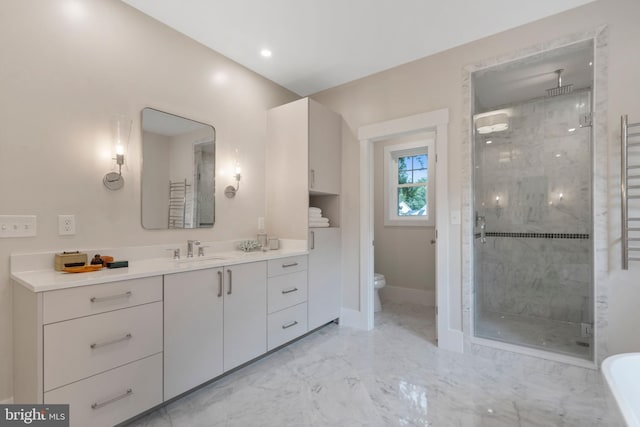 full bath with vanity, baseboards, a shower stall, toilet, and marble finish floor