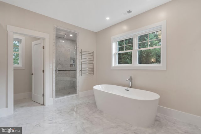 full bath with marble finish floor, a stall shower, baseboards, and a freestanding tub