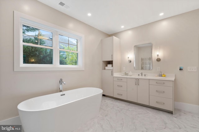 full bath featuring visible vents, recessed lighting, a soaking tub, marble finish floor, and vanity