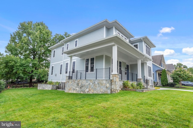 view of front of property with a porch and a front yard