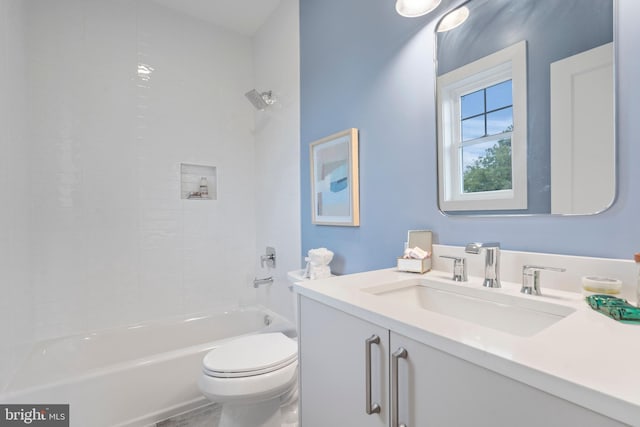 full bathroom with vanity, toilet, and tiled shower / bath combo