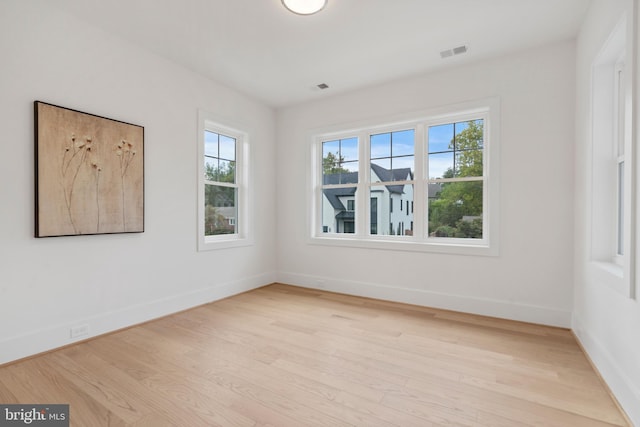 spare room featuring light wood-type flooring