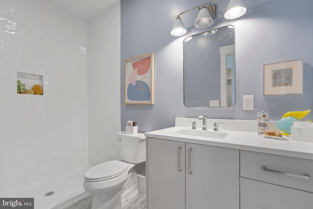 bathroom with vanity, toilet, hardwood / wood-style flooring, and walk in shower