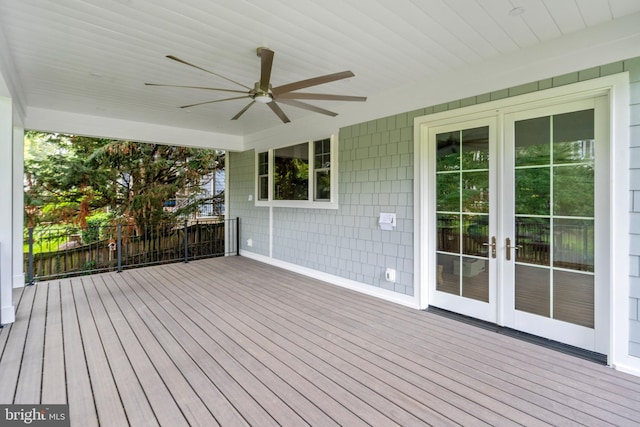 wooden terrace featuring a ceiling fan and french doors