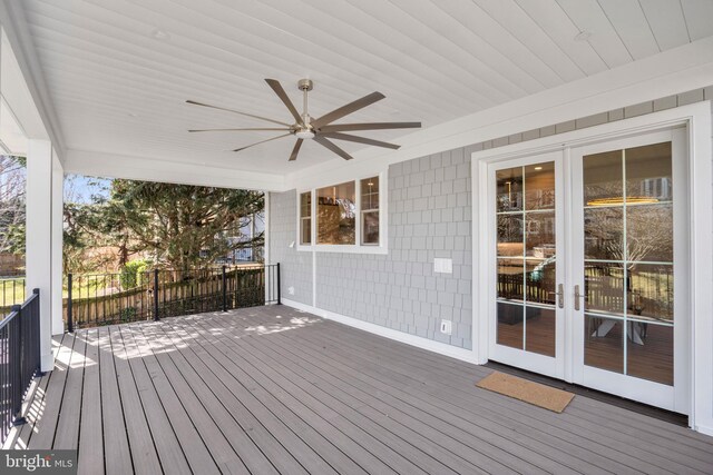 wooden terrace featuring a ceiling fan