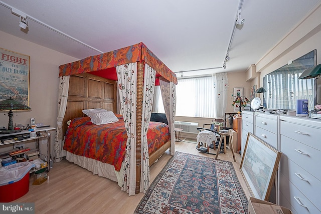 bedroom with light hardwood / wood-style floors