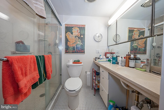 bathroom with toilet, an enclosed shower, vanity, and tile patterned floors