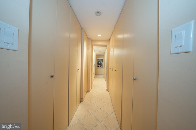 hallway featuring light tile patterned floors