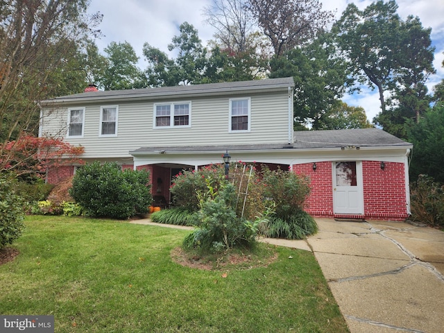 view of property featuring a front yard