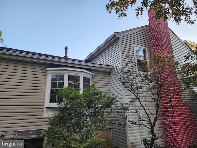 view of home's exterior with central AC unit