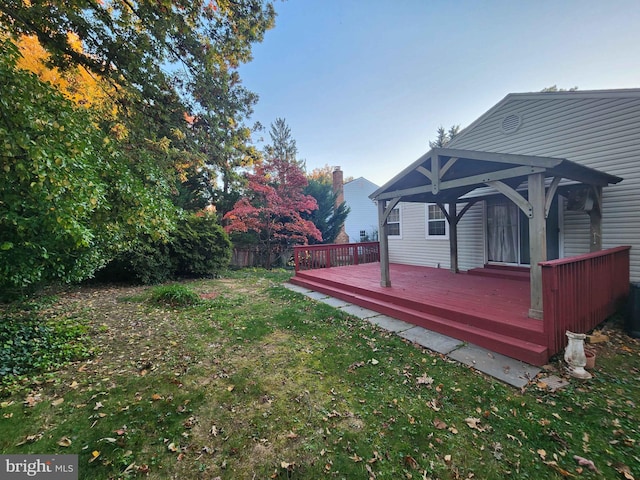 view of yard featuring a wooden deck and a gazebo